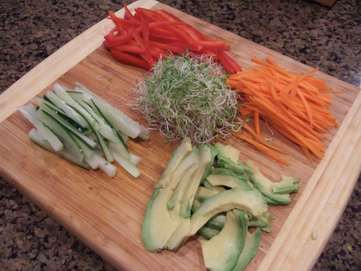 Cucumber, red bell pepper, carrots, avocado, and clover sprouts, ready for nori-rolling fun!